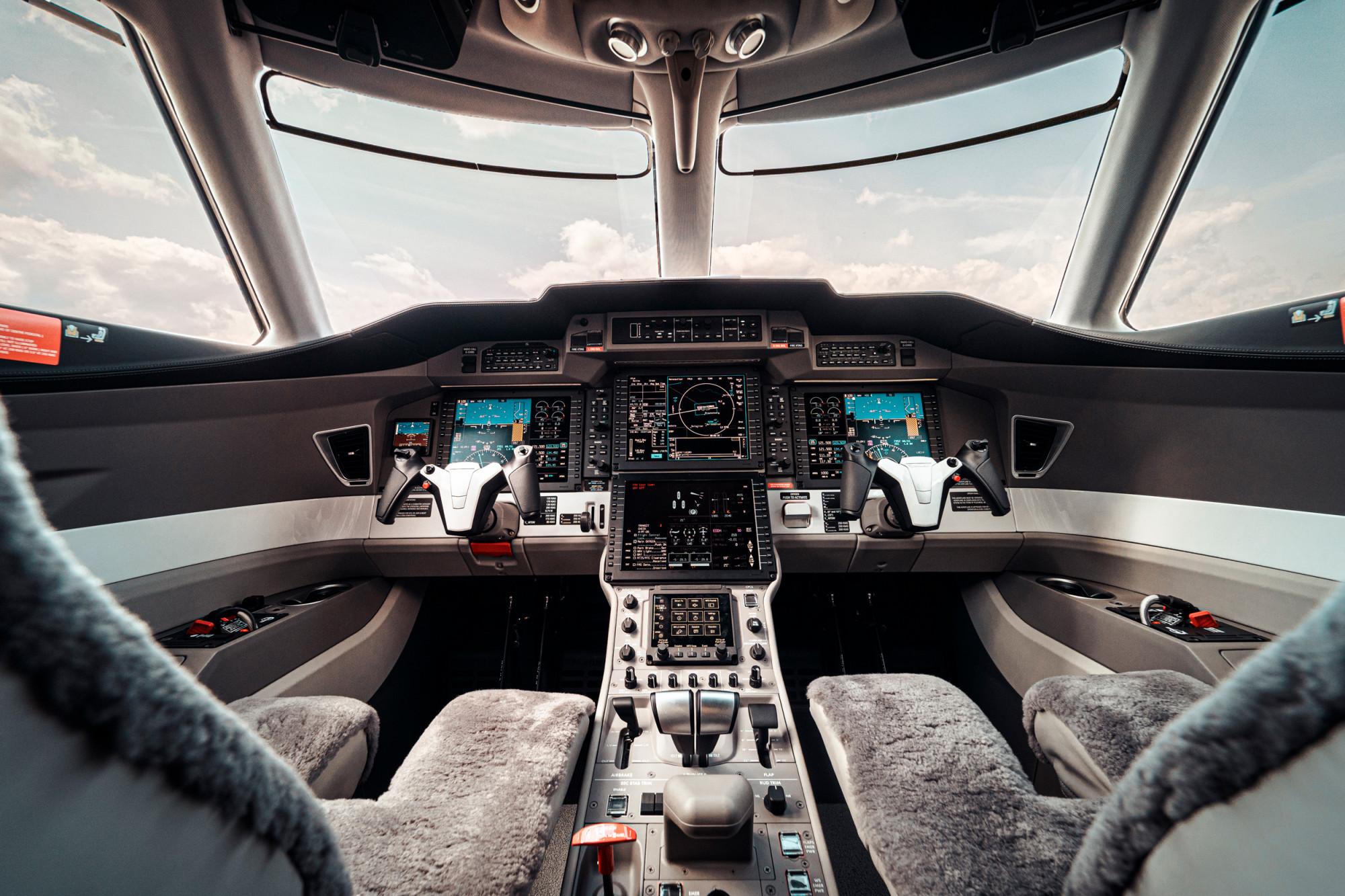 PC-24 jet cockpit from aisleway